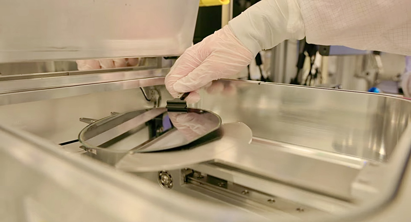 Wafer being removed from semiconductor process equipment — the process development work Applied Materials EPIC Center is built to host
