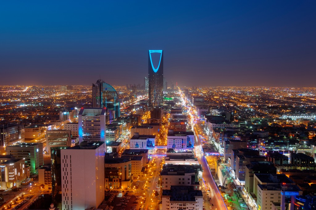 Riyadh at night, where debris from intercepted missiles injured four people during the Aramco headquarters missile strike exchange