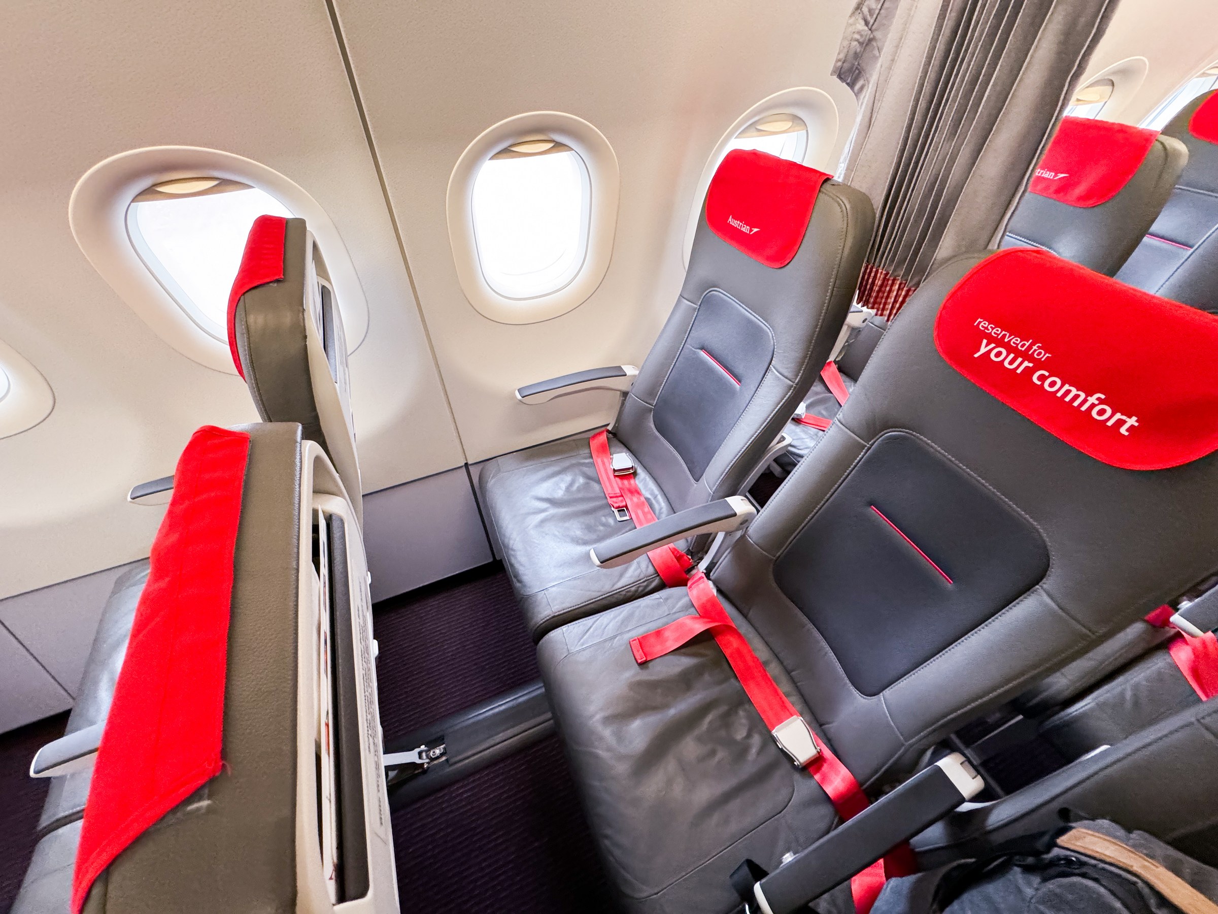 Airbus A320 economy cabin showing seats and overhead bins relevant to clear air turbulence injuries and seatbelt safety