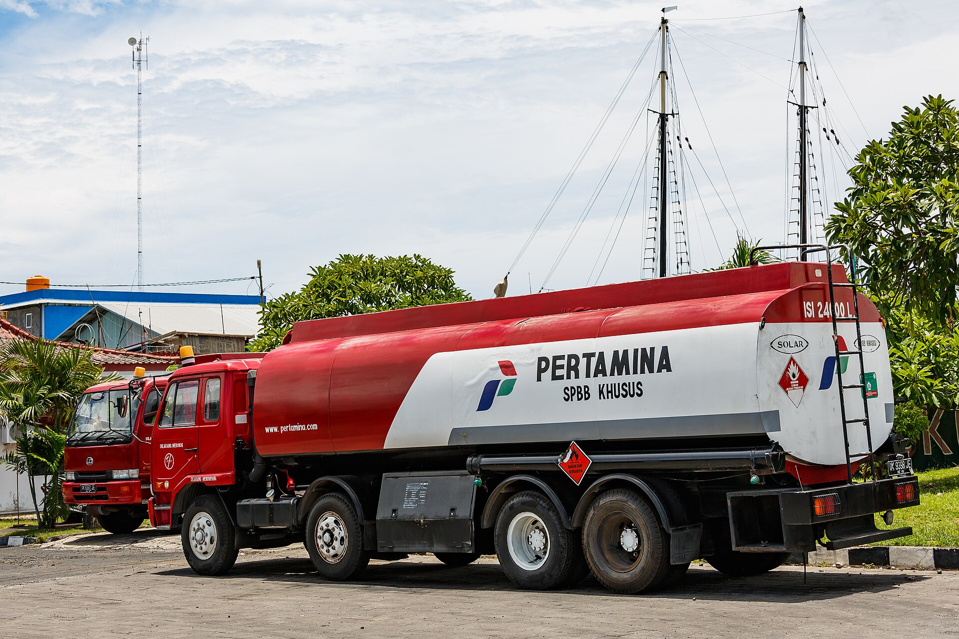 A red Pertamina fuel tanker truck at Benoa, Bali