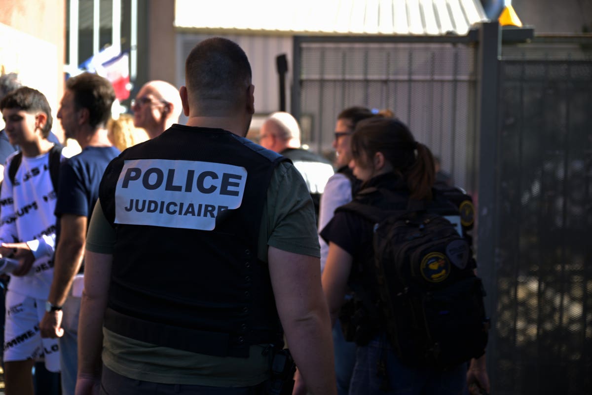 A police officer guards Joseph Lakanal middle school during the Aubagne school shooting investigation