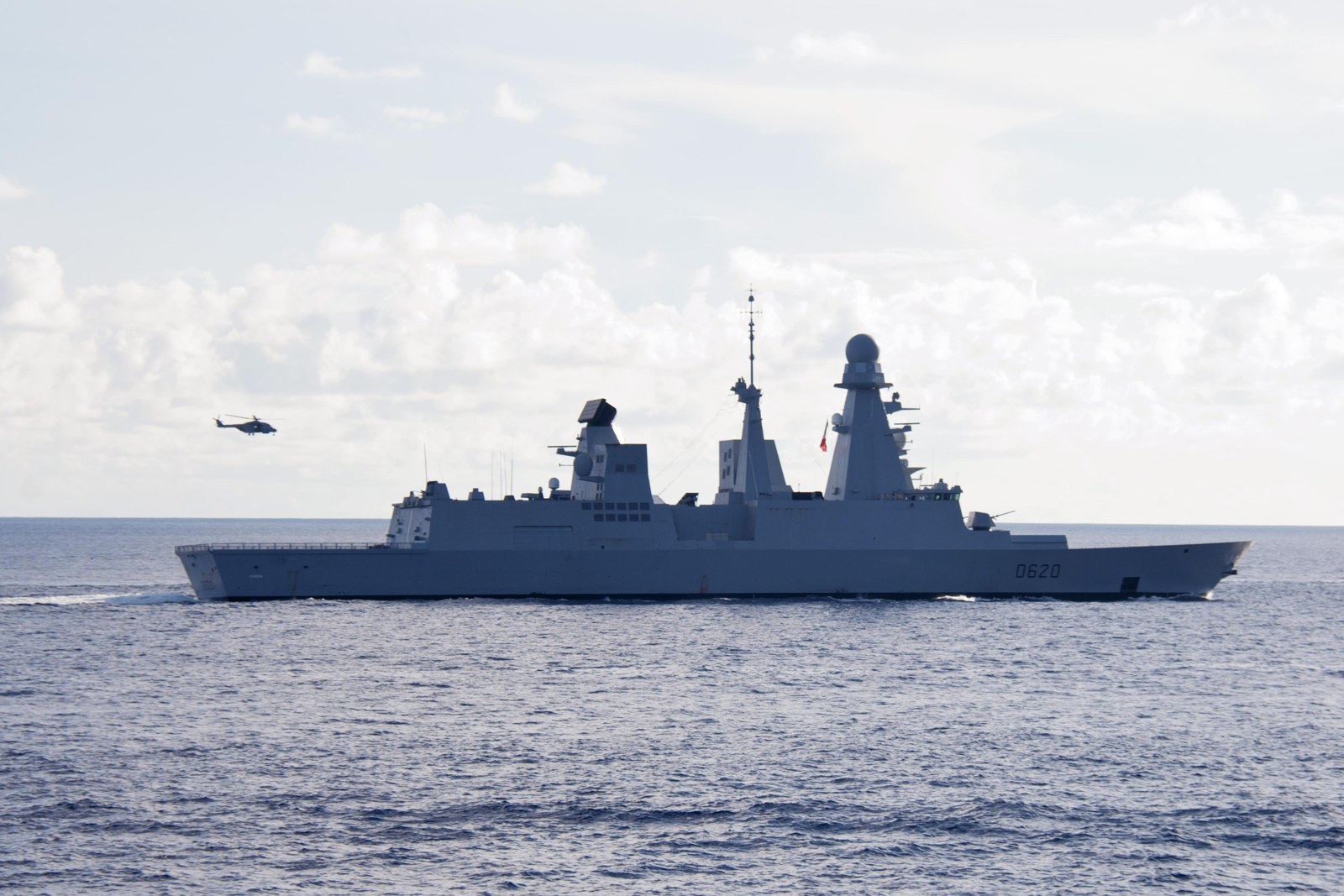 A French destroyer underway in the Indian Ocean with a helicopter airborne — France seizes shadow fleet tanker file photo