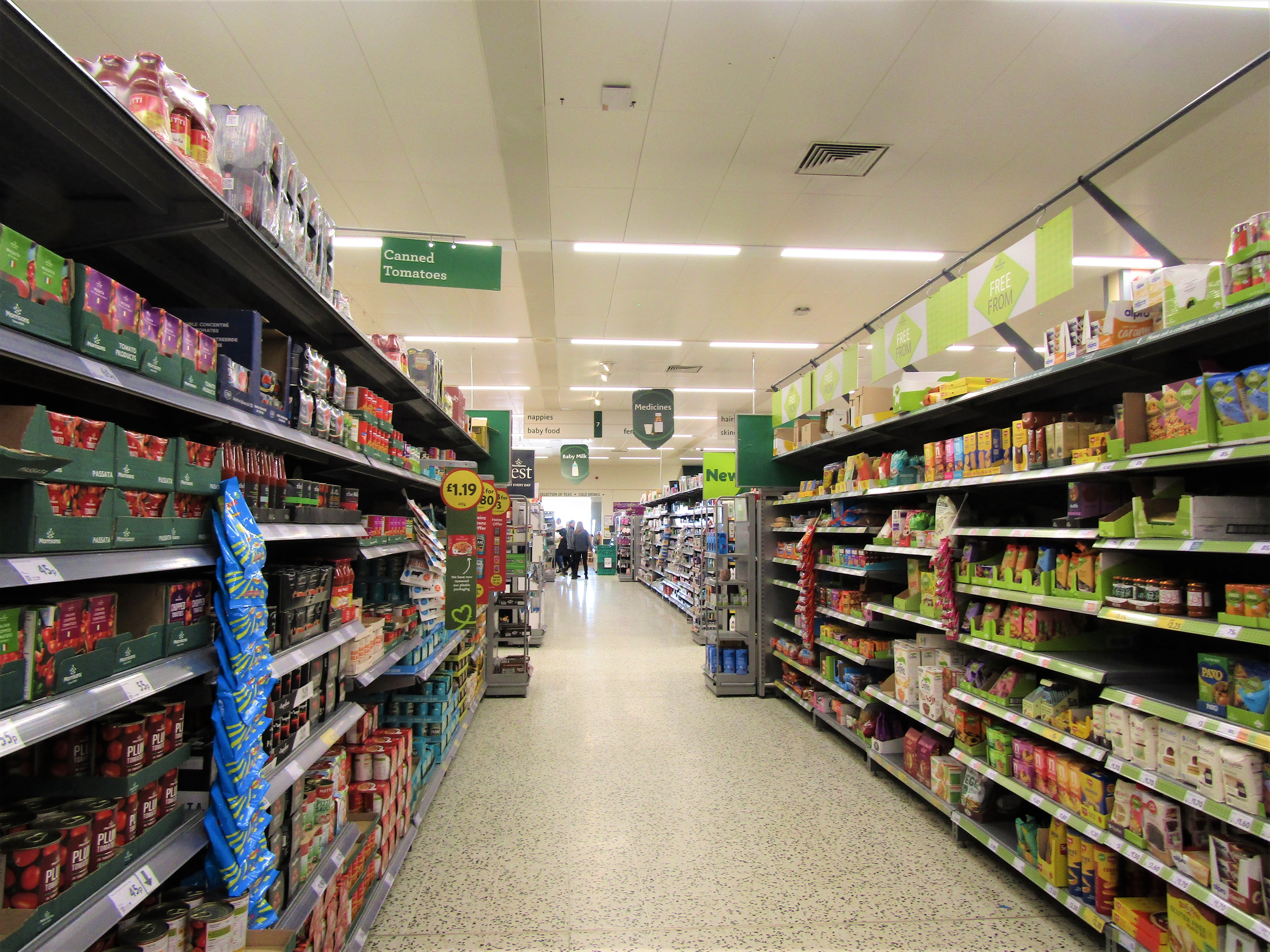 A supermarket shopping aisle — representative image of the refrigerated and frozen-food sections targeted in the French supermarket cyberattack