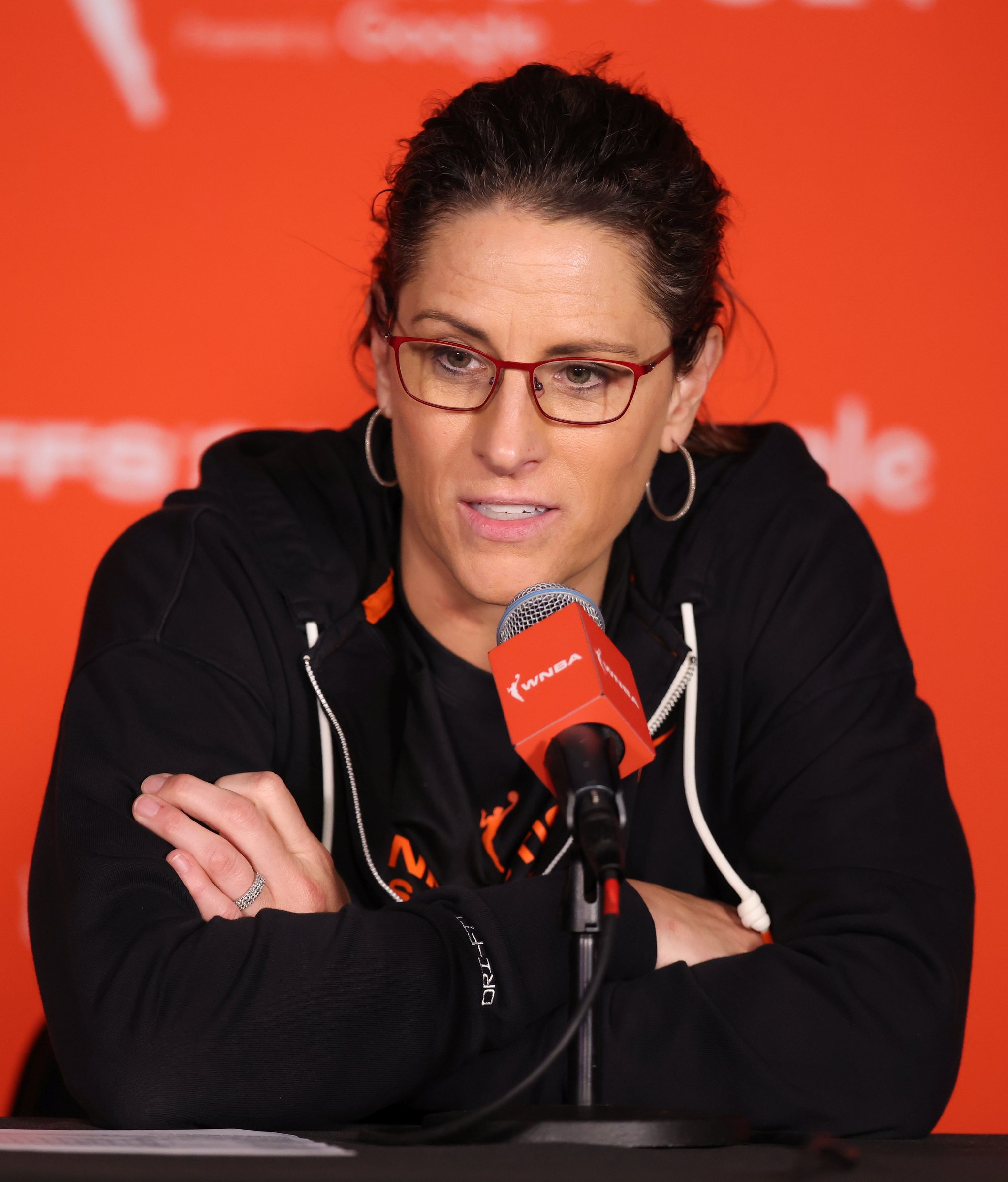 Stephanie White speaking at a WNBA news conference before the Indiana Fever coaching decision for 2027