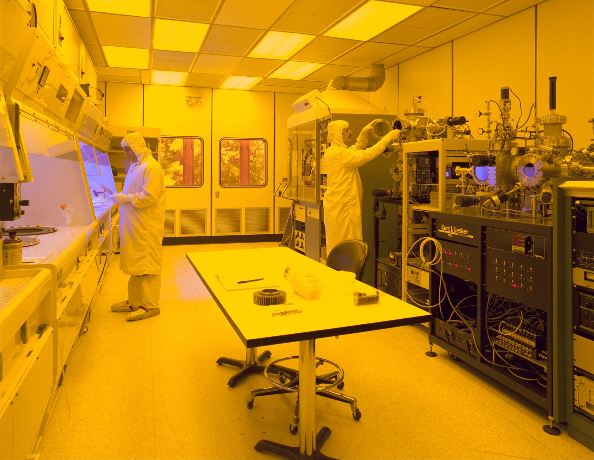 Semiconductor clean room technicians at fabrication equipment — CXMT DRAM competition with Samsung and SK hynix