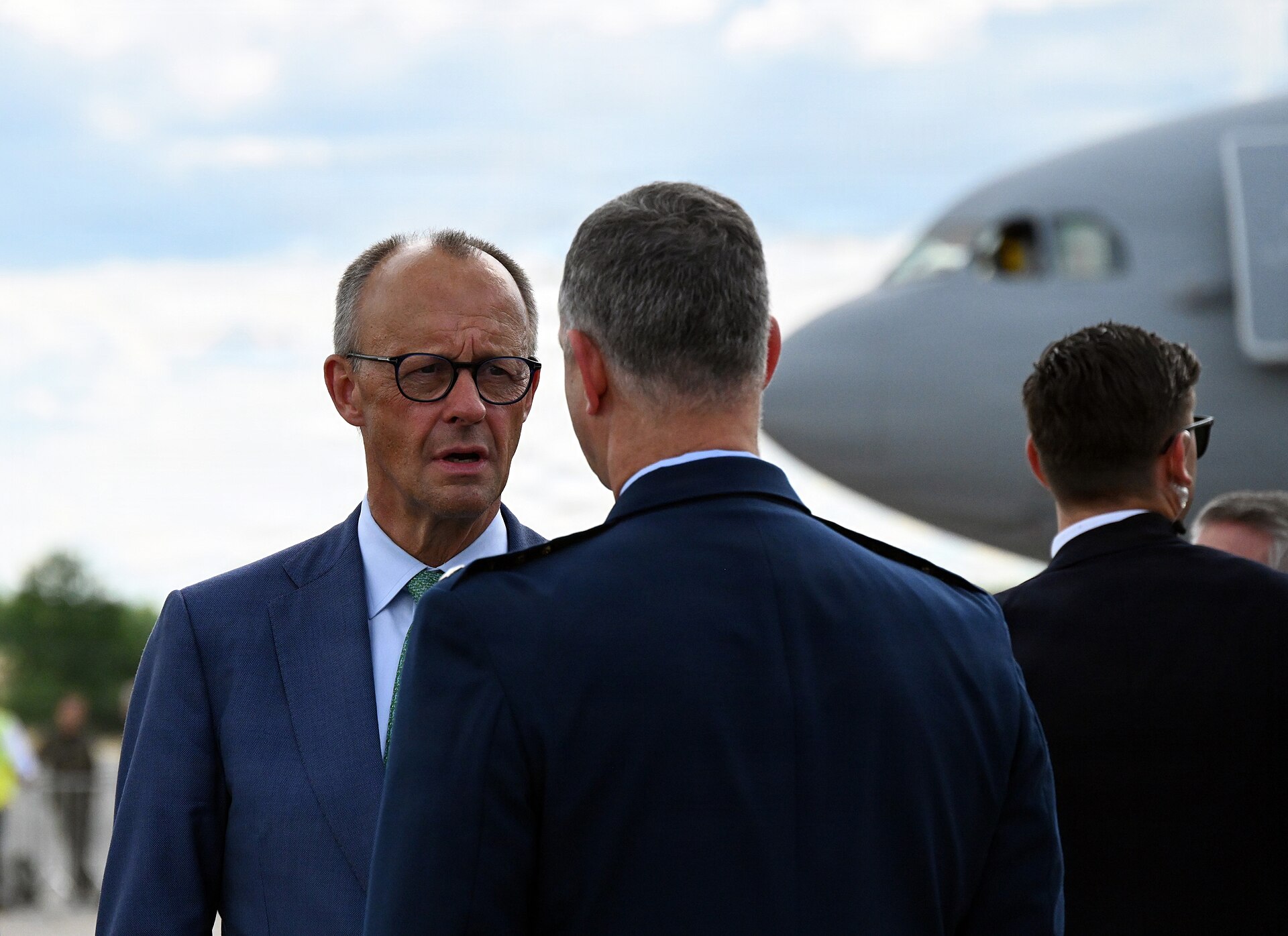 German Chancellor Friedrich Merz speaks with Gen. Alexus Grynkewich during a visit to the U.S. Air Force display area at the ILA Berlin Air Show