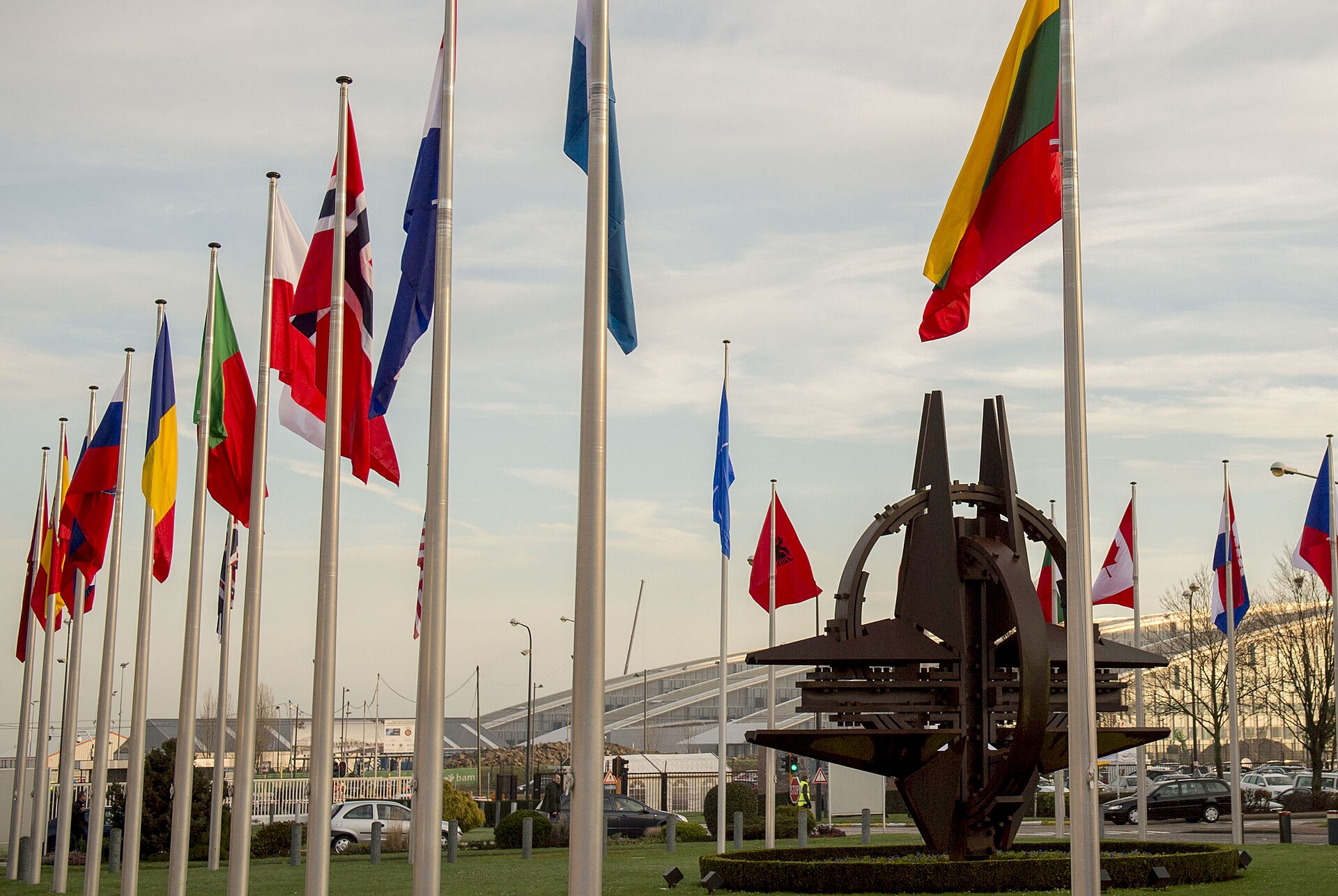 The flags of NATO member states at the entrance of NATO headquarters in Brussels