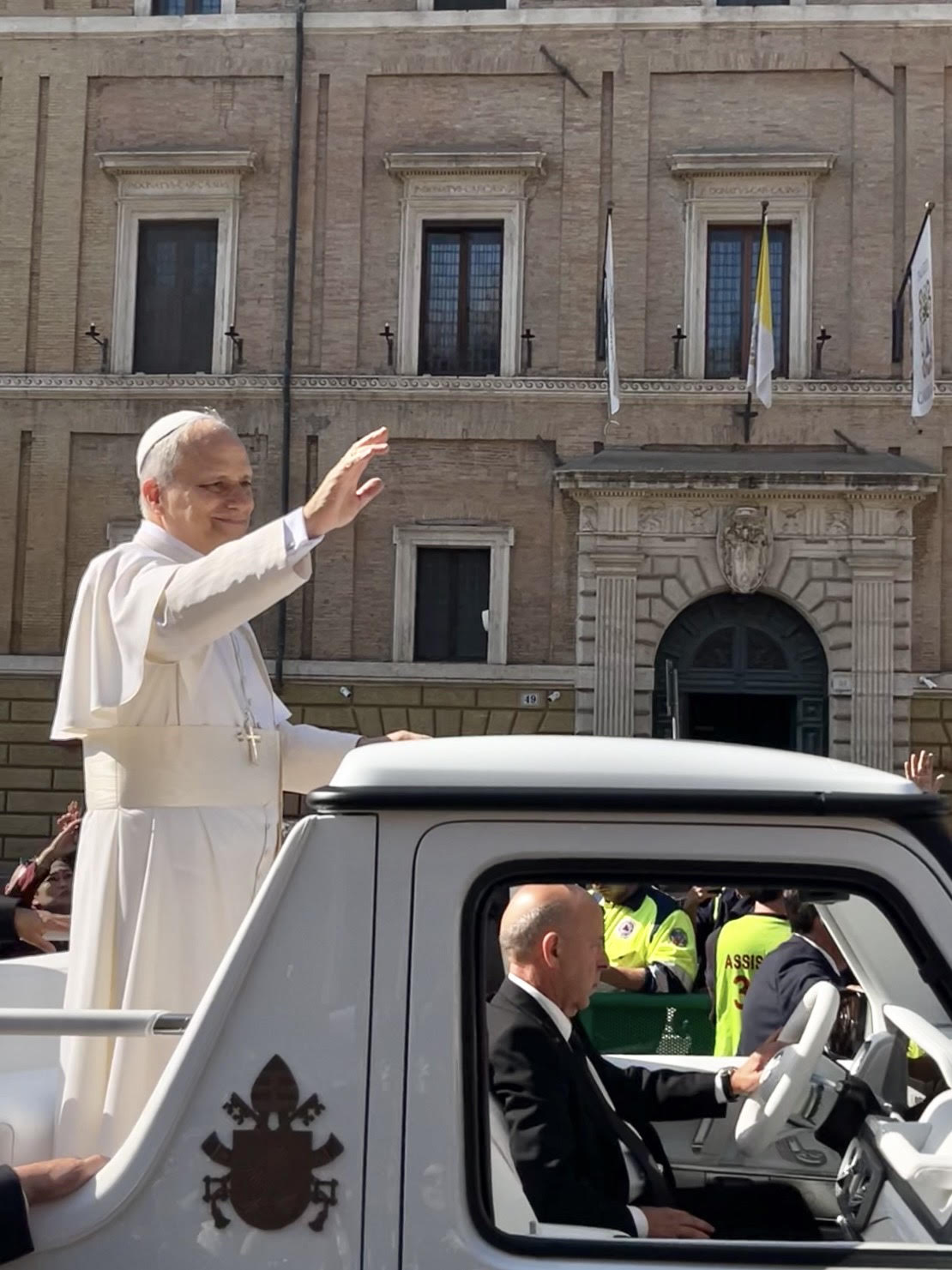 Pope Leo XIV waving from the popemobile on the morning of his inauguration Mass, May 18, 2025