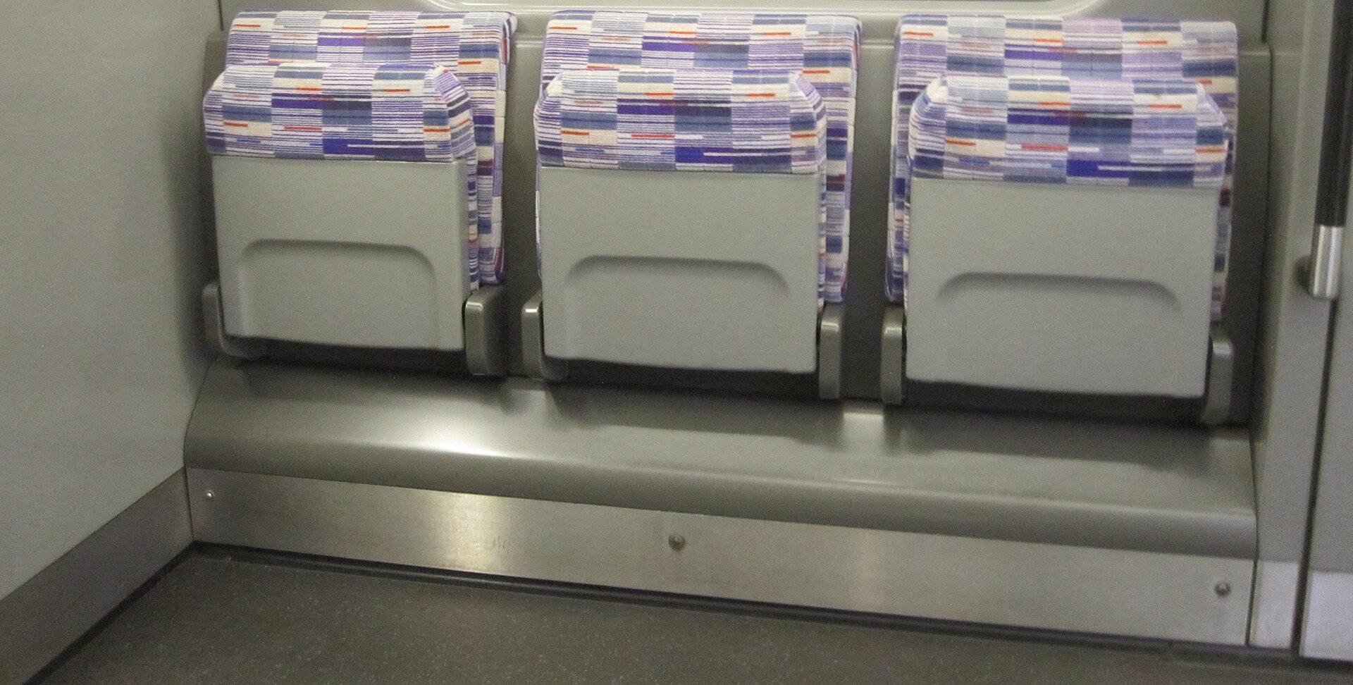 Inside an Elizabeth line train with purple moquette seats — Princess Charlotte Kate Elizabeth line file photo