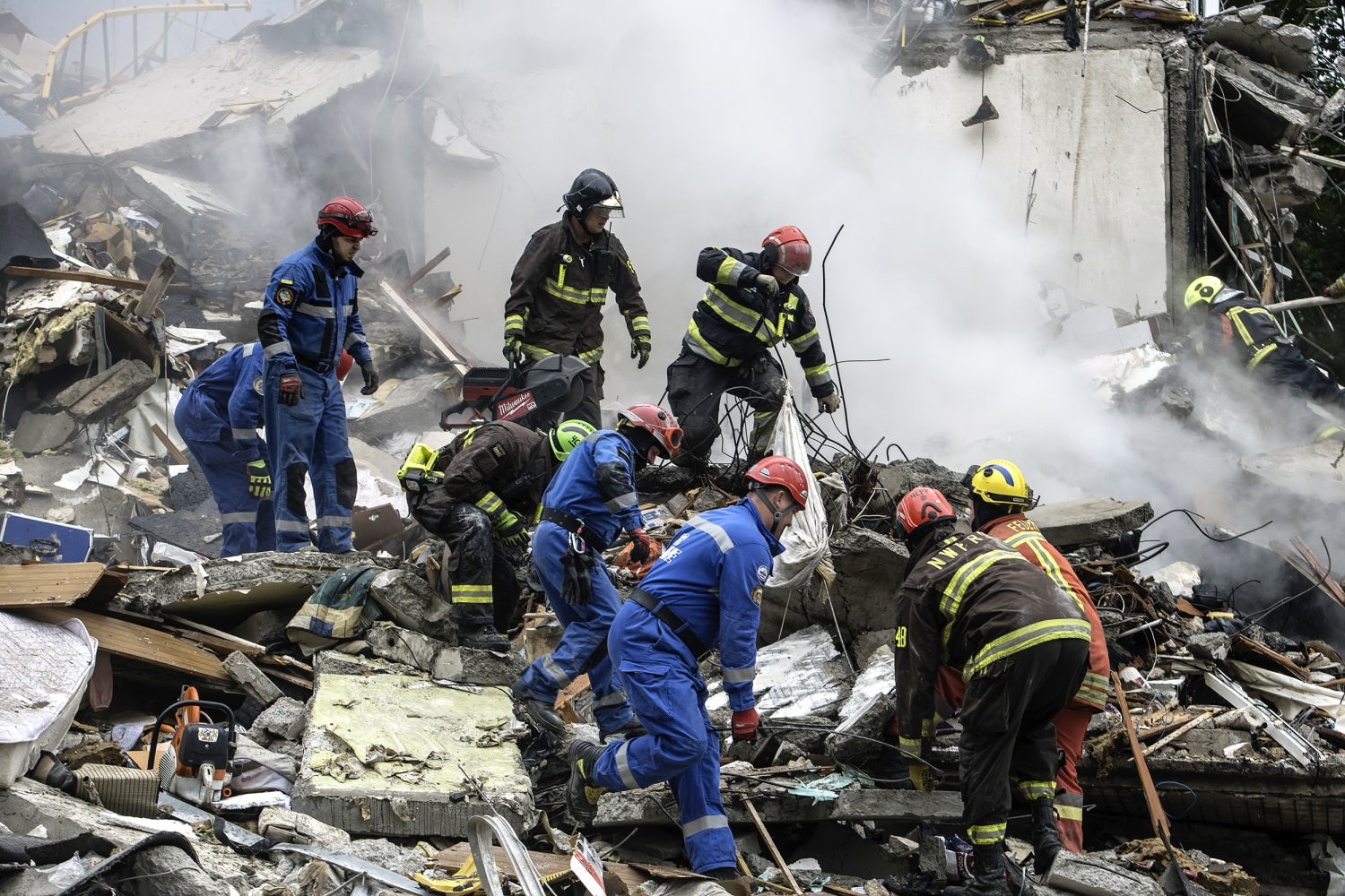 Ukrainian rescue workers at the scene of a strike in Kyiv in August 2025, file photo