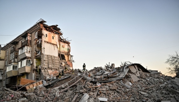 Rescue workers at a damaged building in Zaporizhzhia after a Russian airstrike in November 2024, file photo