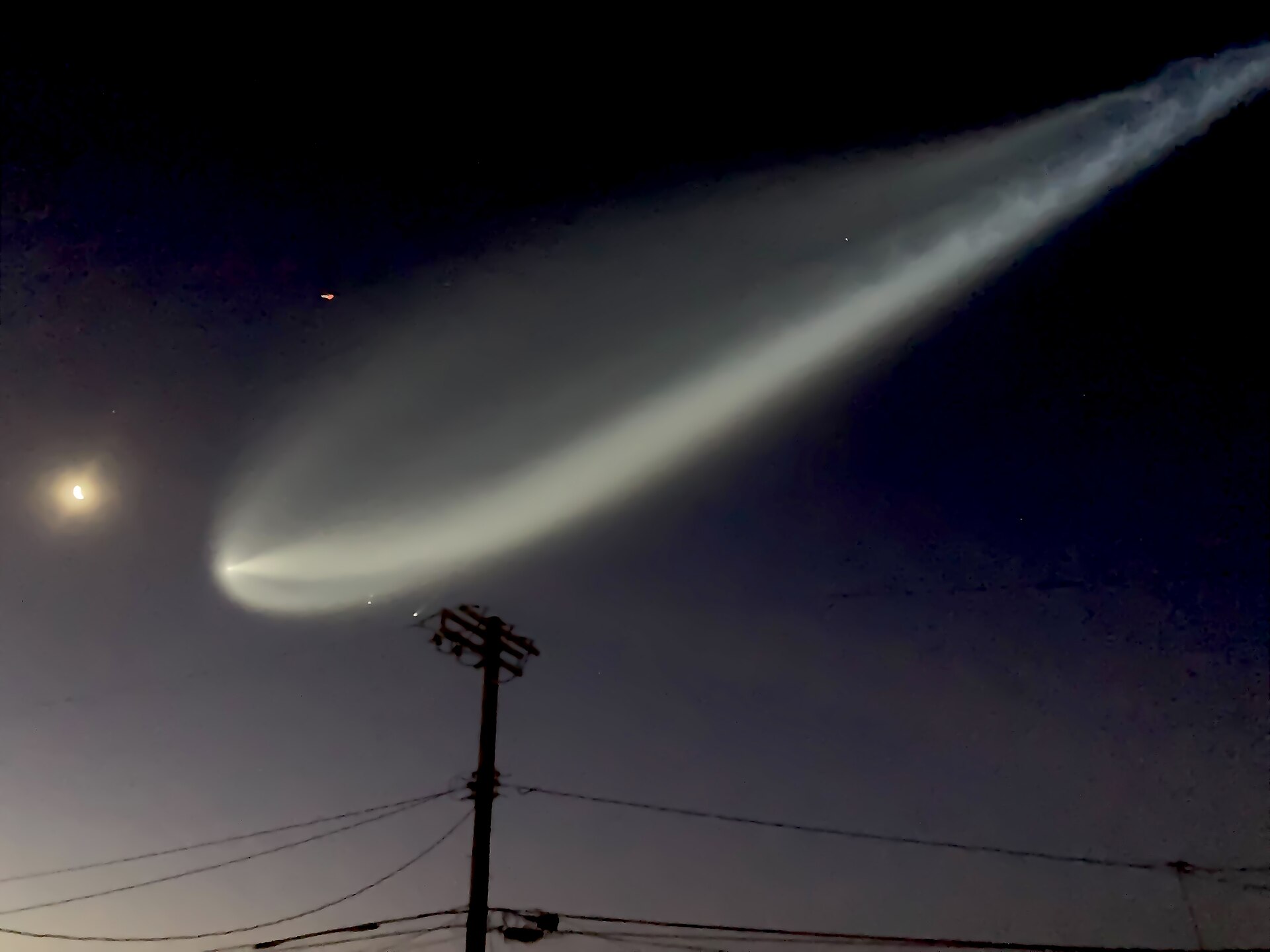 Falcon 9 exhaust plume blooming into a space jellyfish at dawn — SpaceX launch today file photo