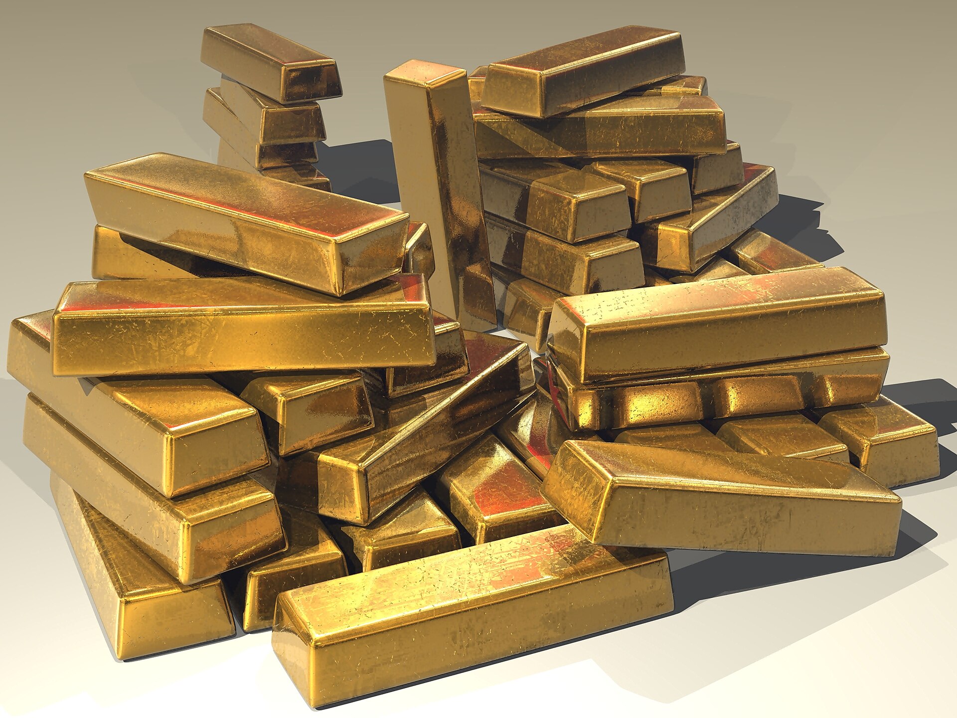 Gold bullion bars as Comex gold settled lower at $4,165.80 an ounce on October 12, 2026 while oil climbed