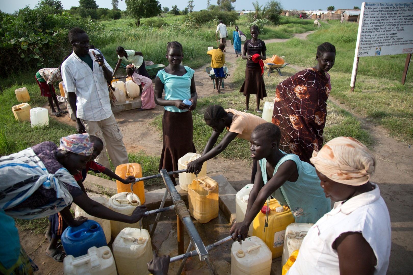 Displaced people collect water at Payuer camp in Renk, South Sudan, illustrating the wider Sudan displacement crisis