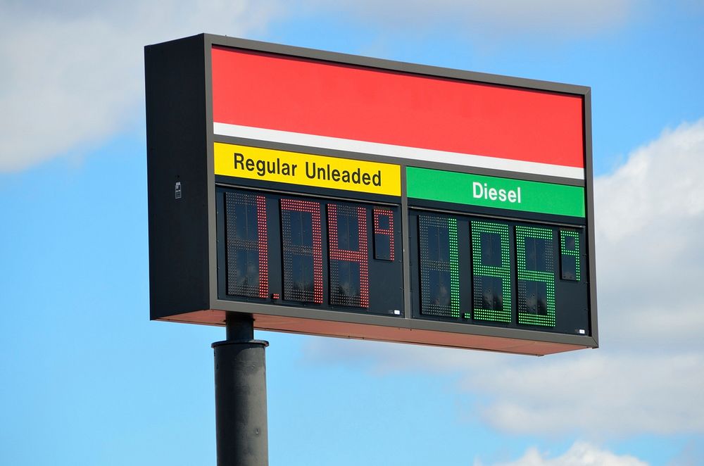 Gasoline and diesel prices displayed on a roadside service-station sign