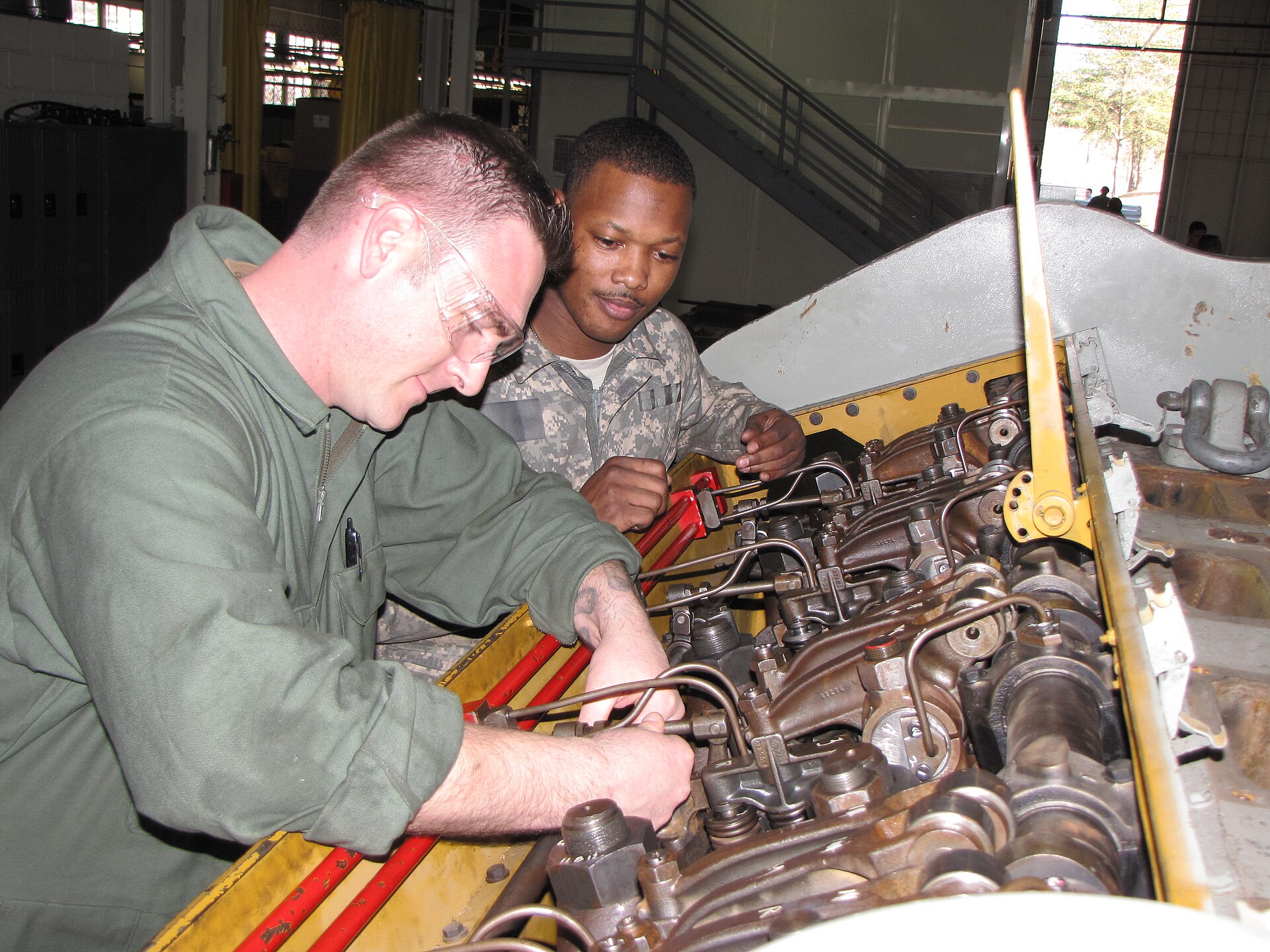 A mechanic adjusting the fuel rack on a diesel engine trainer, Clean Air Act conspiracy pardon Alaska diesel emissions
