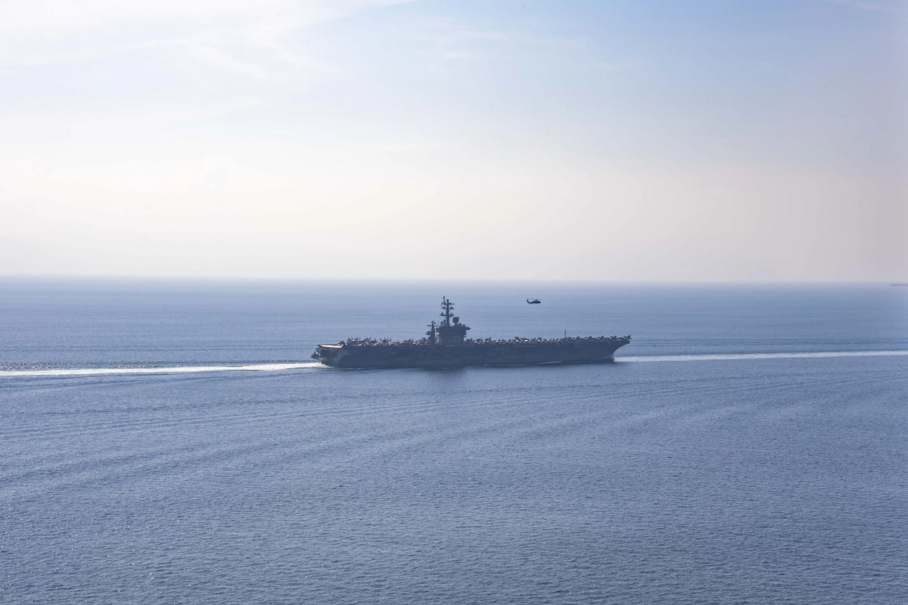 The USS Dwight D. Eisenhower underway — the carrier strike group has anchored the U.S. naval posture near the Strait of Hormuz