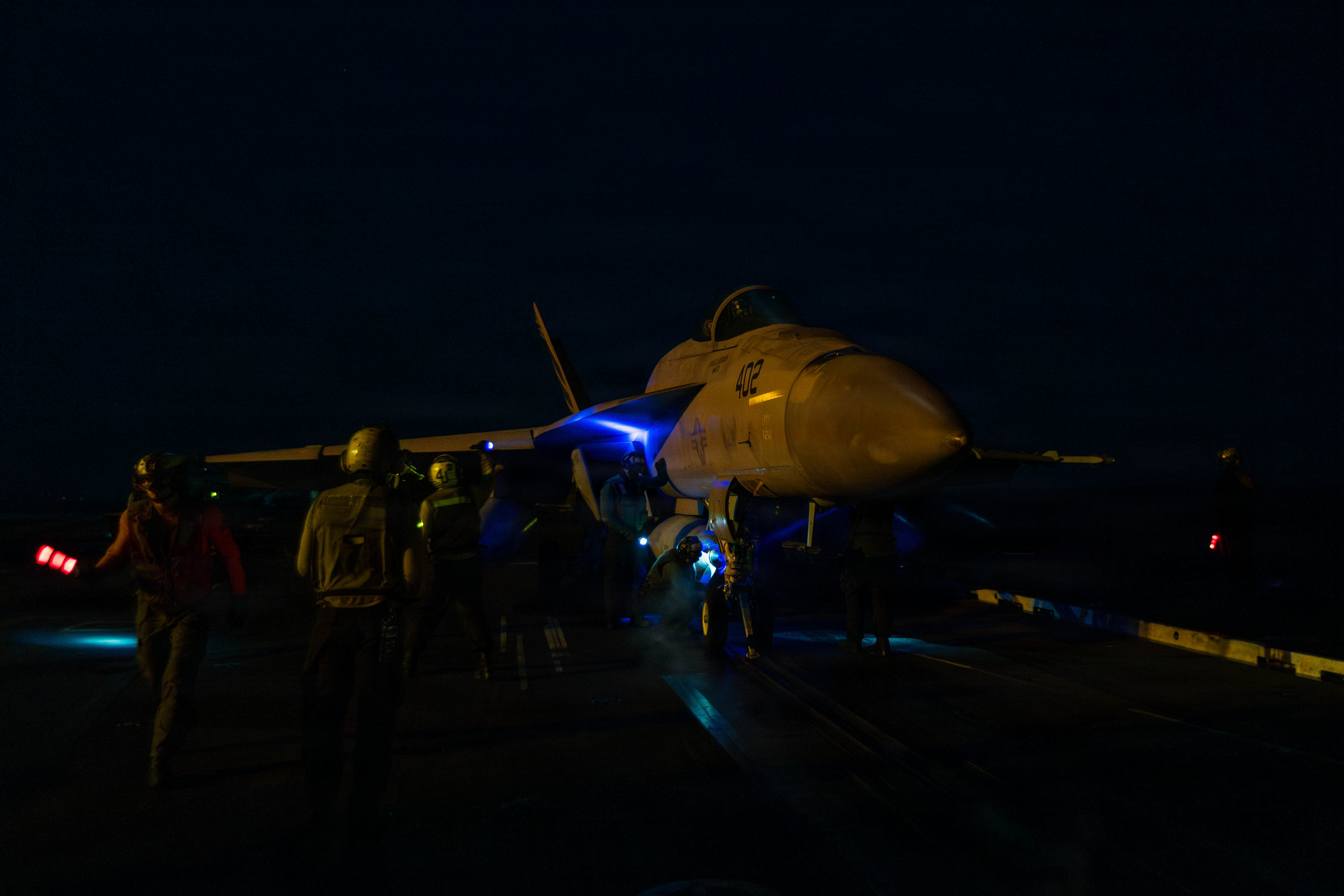 An F/A-18E Super Hornet prepares to launch from the Lincoln's flight deck during night operations