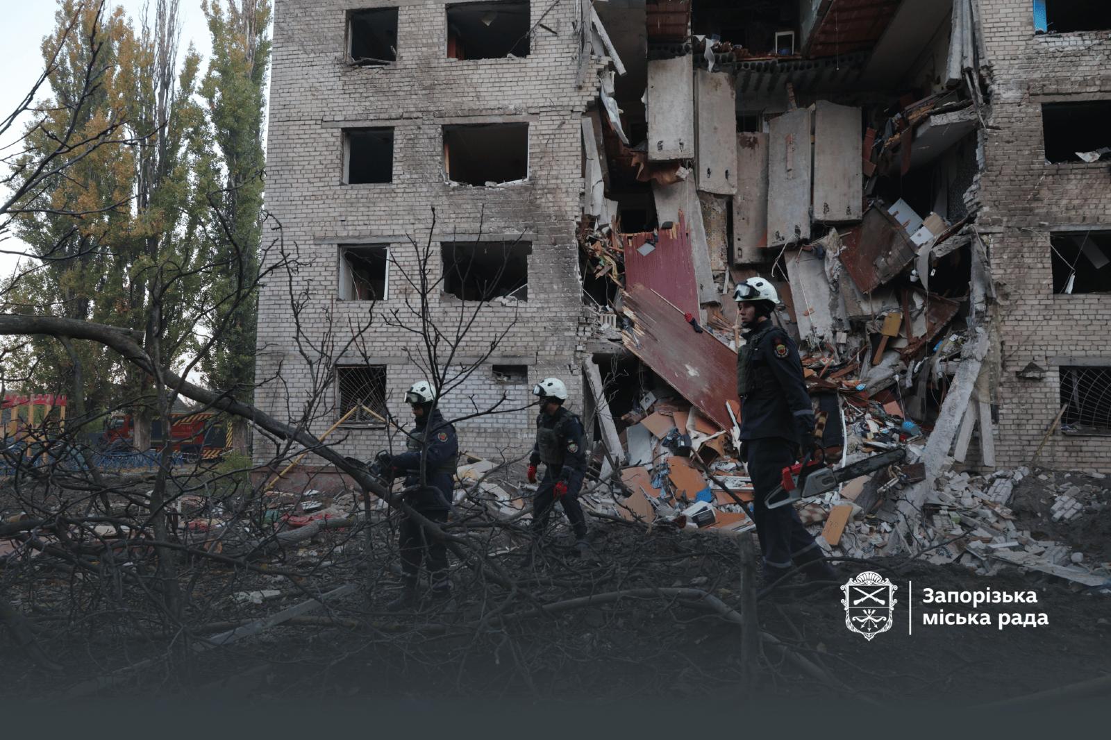 Emergency workers clearing shattered buildings after an earlier Russian attack in Zaporizhzhia