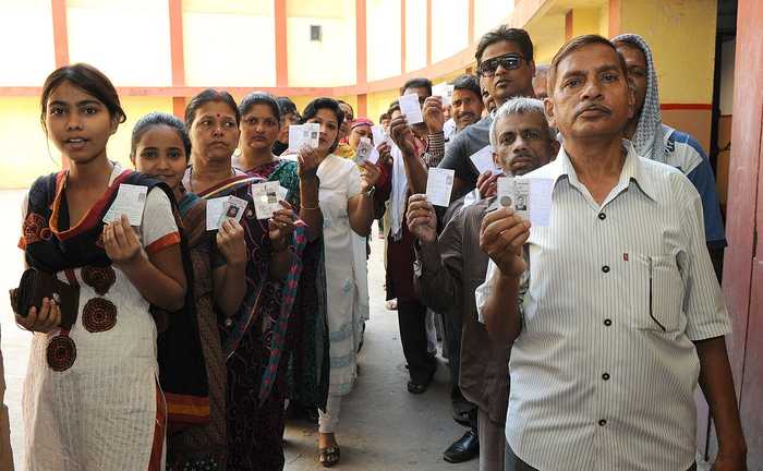 Indian voters waiting in line at a polling station during the 2014 general election