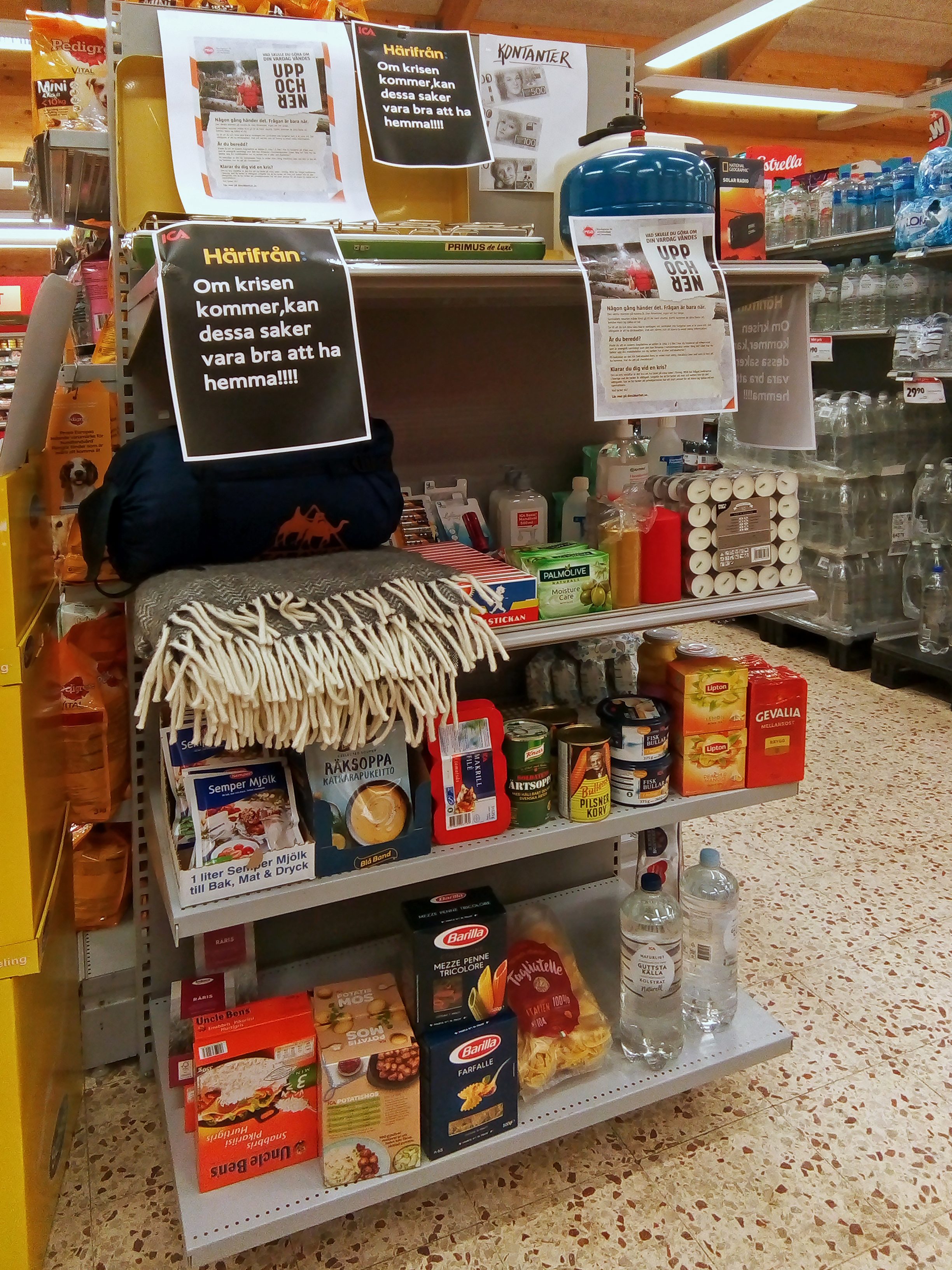 A Swedish supermarket display of emergency supplies recommended in the If Crisis or War Comes brochure, part of how Europe prepares citizens for war