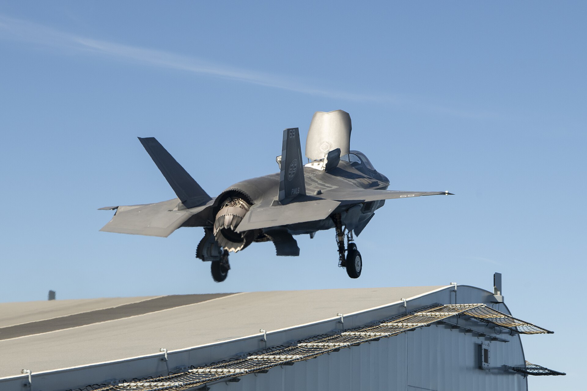 An F-35B Lightning II performing a short takeoff from the ski jump of HMS Prince of Wales — F-35B jets form the strike element of the Arctic deployment air group