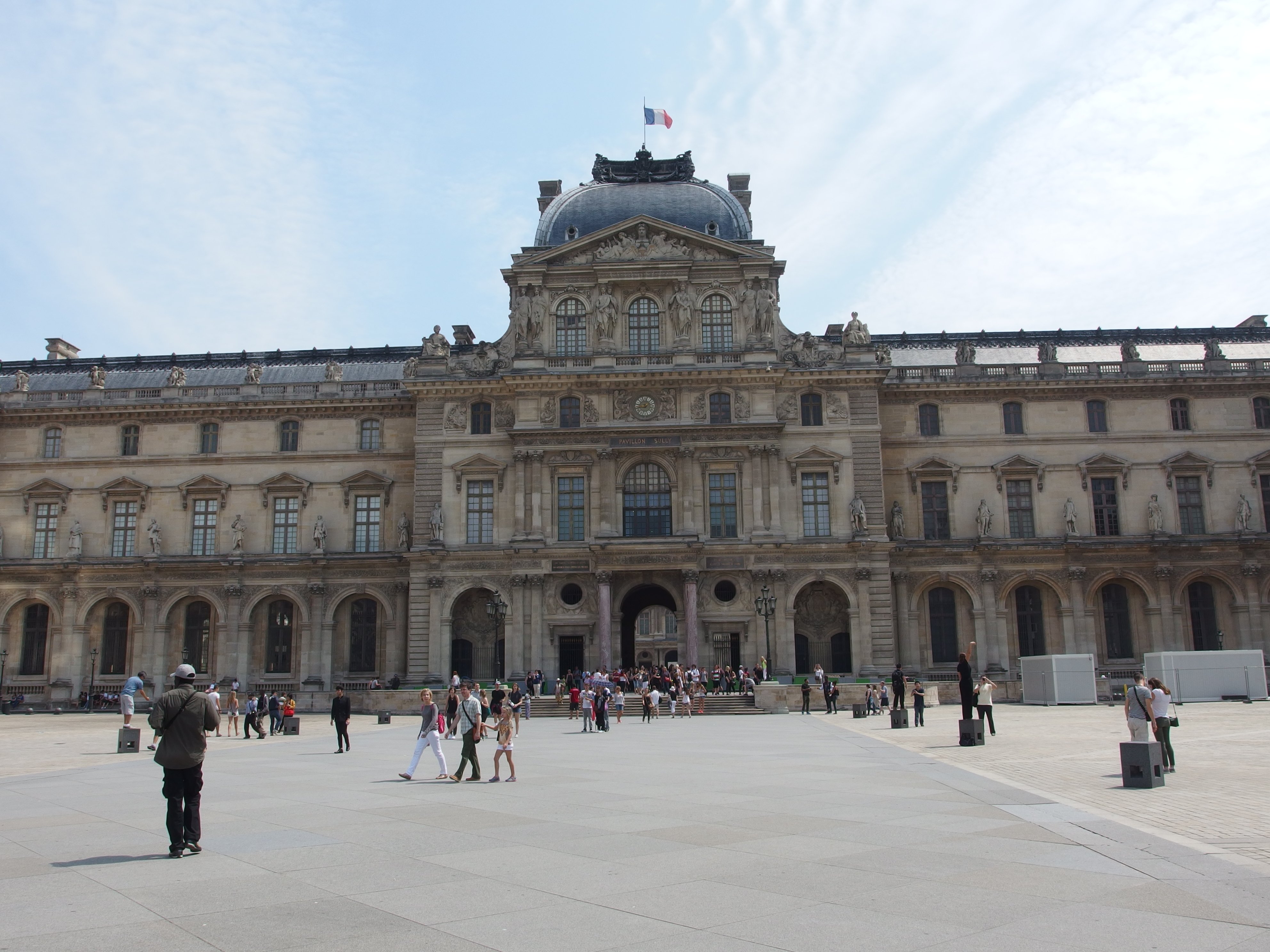 The Louvre Pyramid and Cour Napoleon in Paris — the Louvre will close on Saturday as France braces for a second weekend of protests