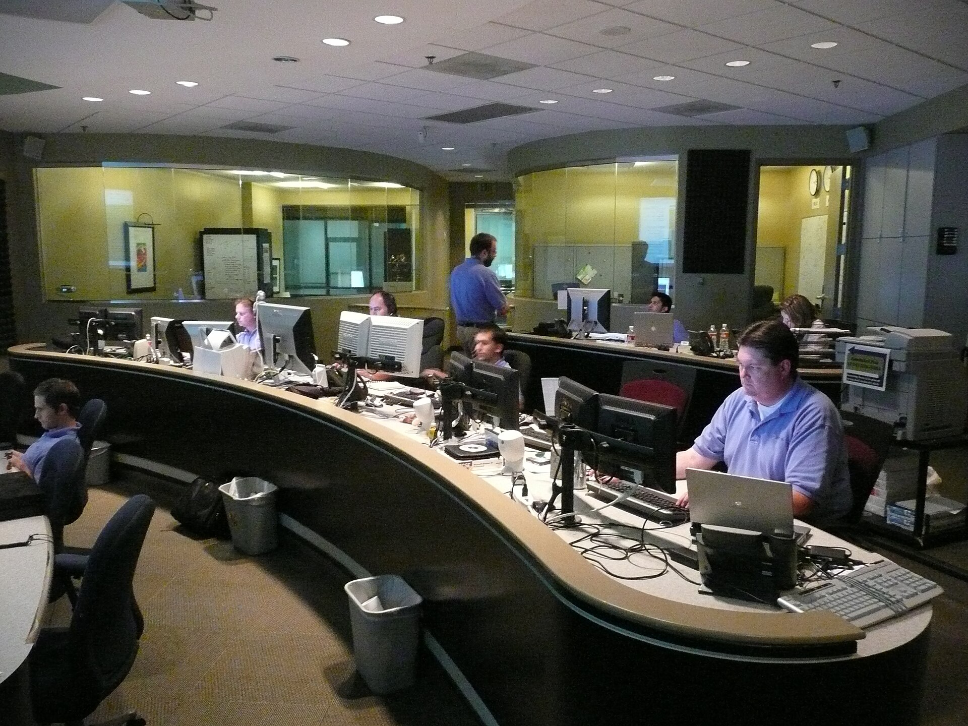 Staff in a network operations center monitoring systems during the PHP2Shell emergency patch rollout