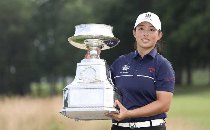 China's Yin Ruoning holding the Women's PGA Championship trophy
