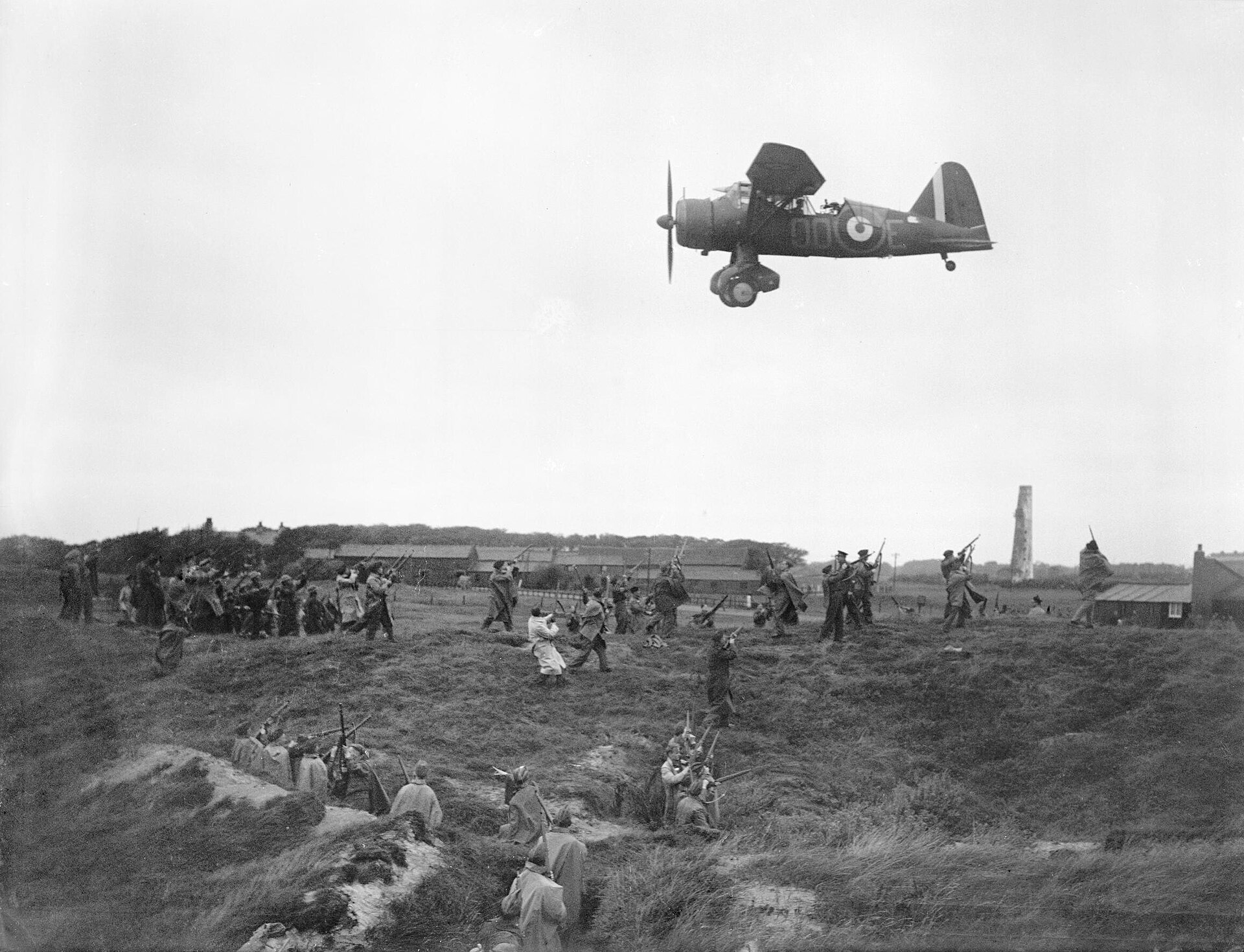 Home Guard members train under a low-flying RAF Lysander aircraft at Altcar in September 1940