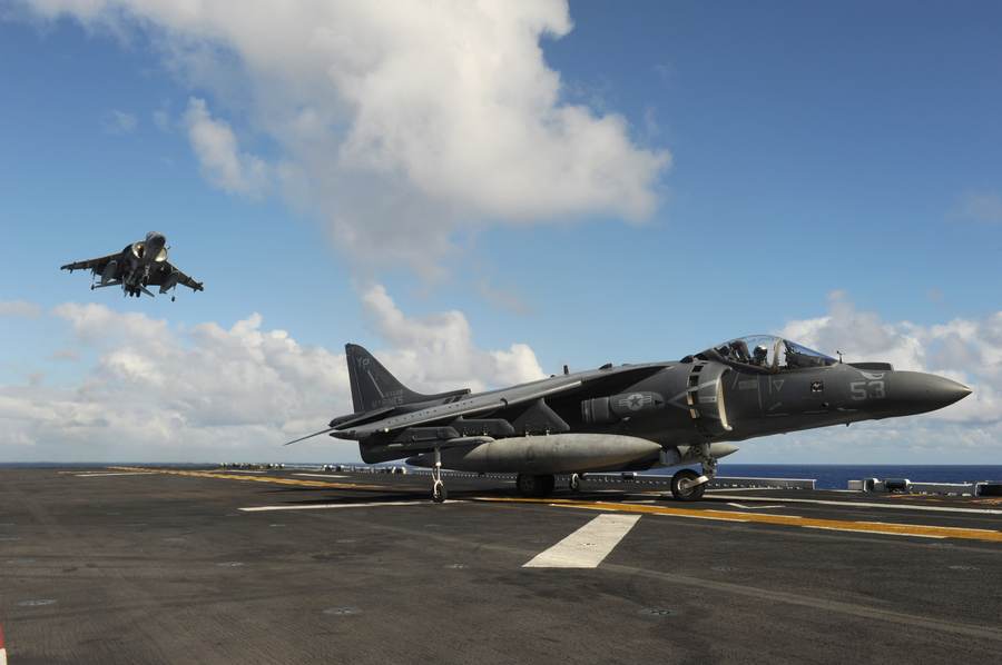 AV-8B Harriers approach the flight deck of USS Makin Island during operations in October 2016