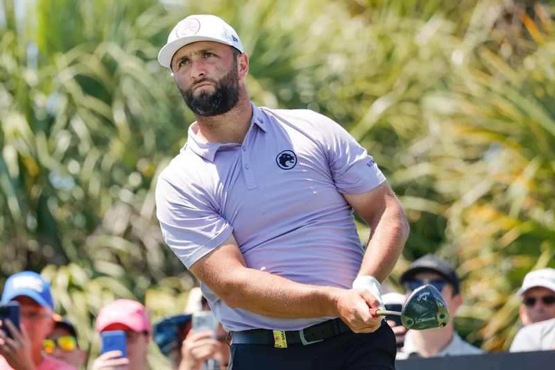 Jon Rahm watches his drive during a LIV Golf round