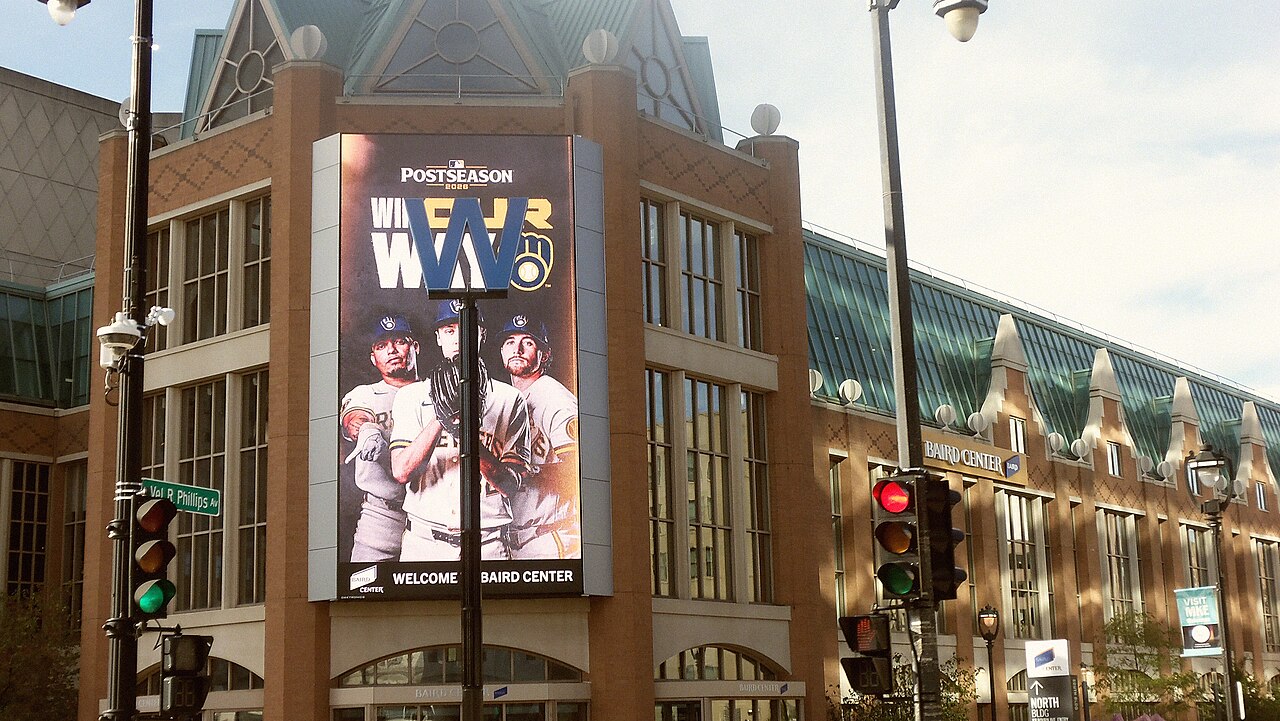 Brewers World Series Milwaukee fans — the Brewers Win Our Way postseason banner on the Baird Center in downtown Milwaukee ahead of the 2026 World Series