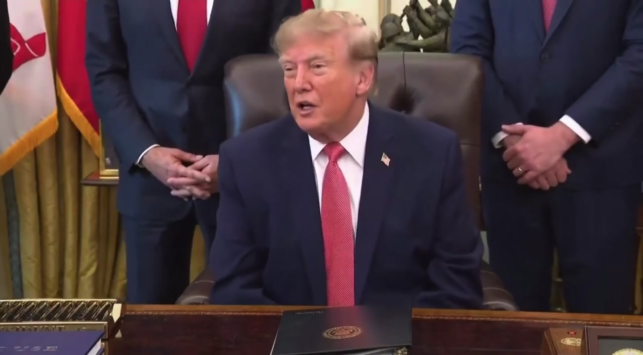 President Donald Trump speaking at the Resolute desk, flanked by administration officials, during the October 20 WHIP event