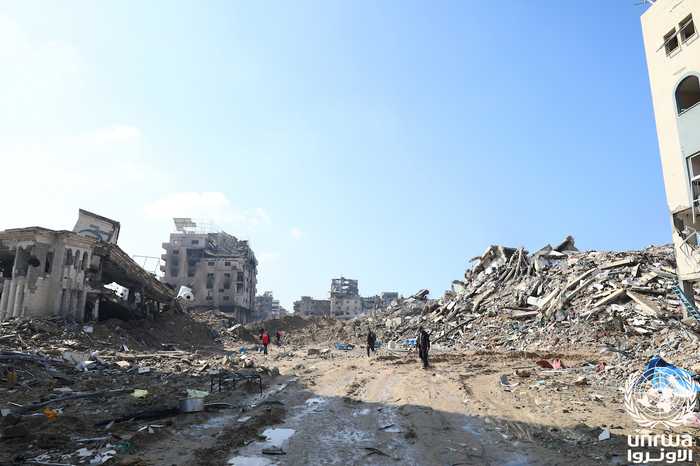 Destroyed residential buildings in Gaza City's Al-Maqousi quarter — context for the Ali al-Amoudi Gaza strike