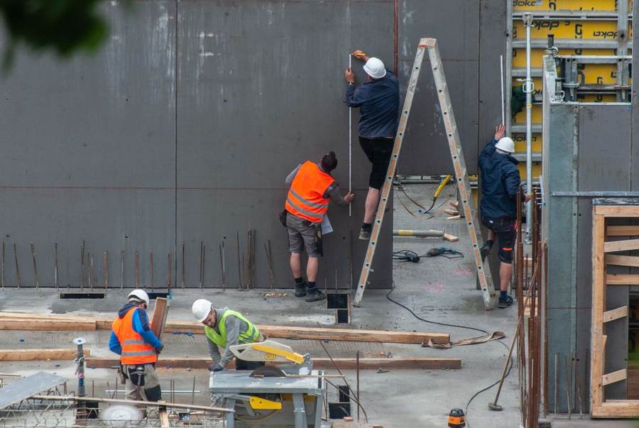 Construction workers on a building site — construction added 11,000 jobs in the September jobs report