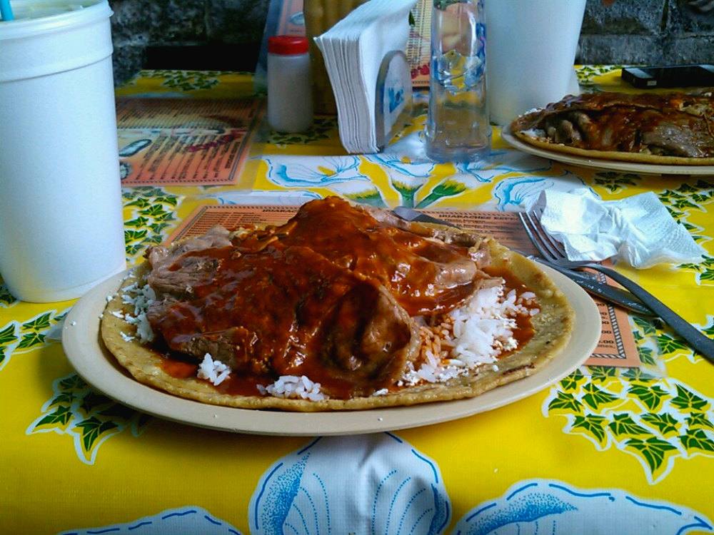A huarache and garnishes served at Arroces del Baby Face near Arena México in Mexico City's Doctores neighborhood