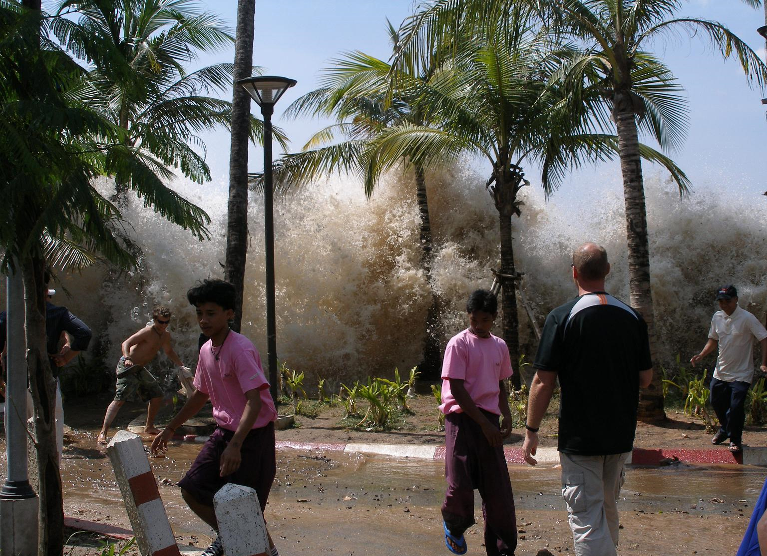 A tsunami wave surging ashore in Ao Nang, Thailand, in 2004