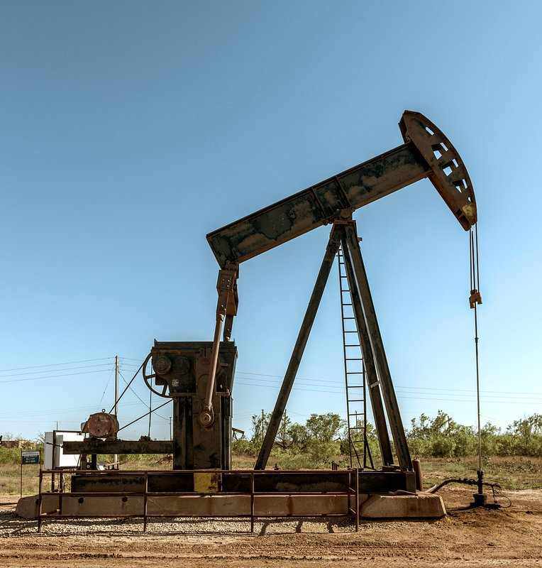 Pumpjack at an aging oilfield illustrating an enhanced oil recovery project