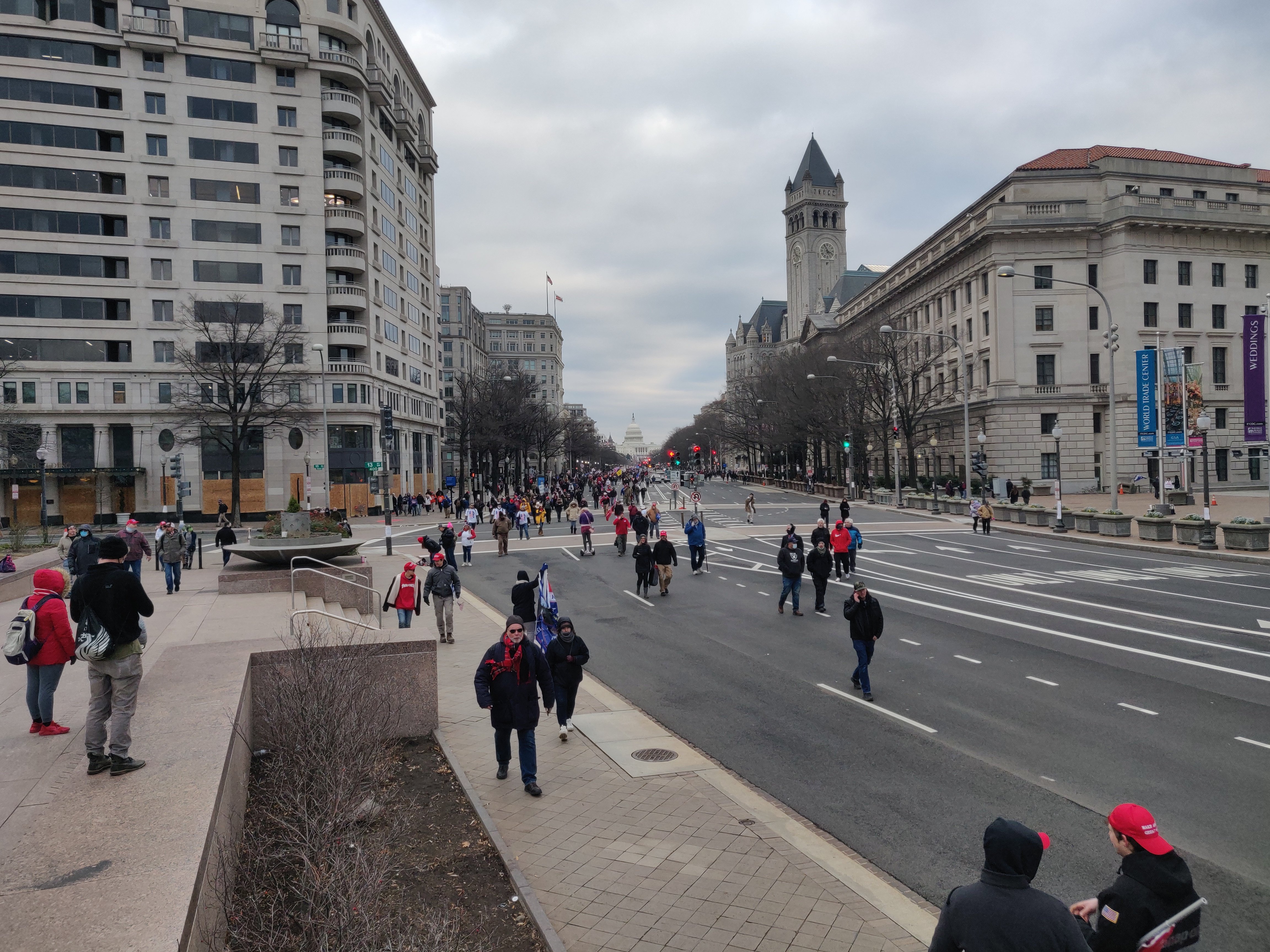 Panorama documentary edited speech — Trump supporters walking along Pennsylvania Avenue toward the U.S. Capitol, its dome visible in the distance, on January 6, 2021