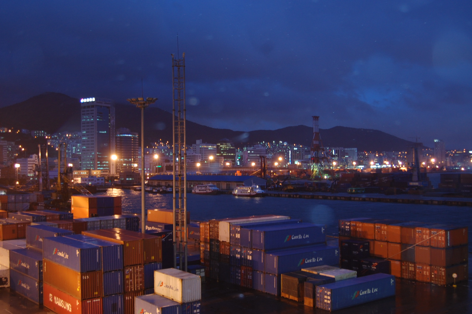 South Korea exports October 2026 — shipping containers stacked at Busan harbour at dusk