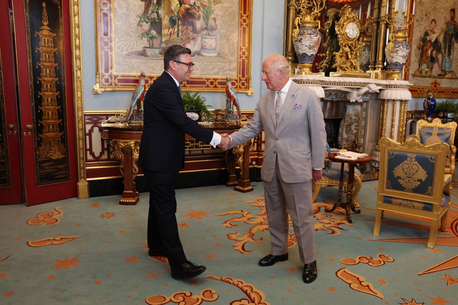 Prime Minister Andy Burnham, whose rough sleeping Christmas pledge was made on his first day in Downing Street, being received by King Charles III