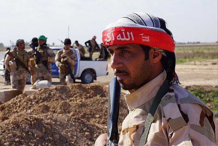 A Hashed al-Shaabi fighter — Kataib Hezbollah's disarmament refusal challenges Iraq PM al-Zaidi's disarmament plan