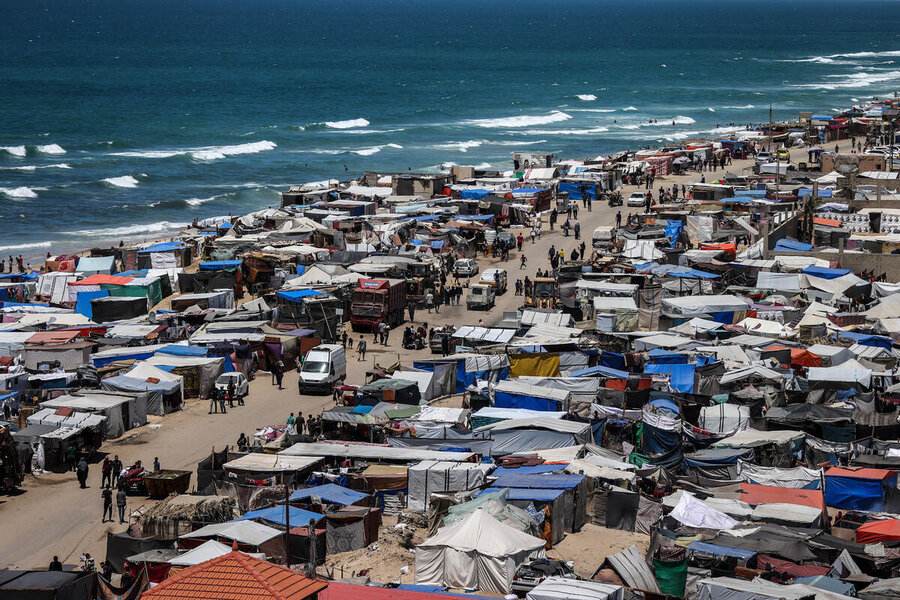Displacement shelters along the Gaza coast, where naval fire toward Rafah and Gaza City was reported Sunday