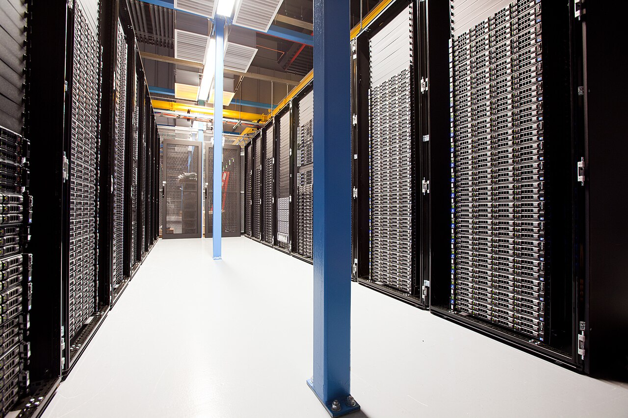 Rows of computer servers and network equipment in a data center