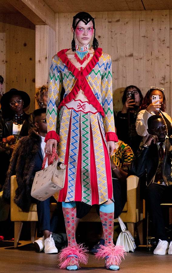 Model wearing vividly patterned Maxhosa Africa knitwear on a Paris runway