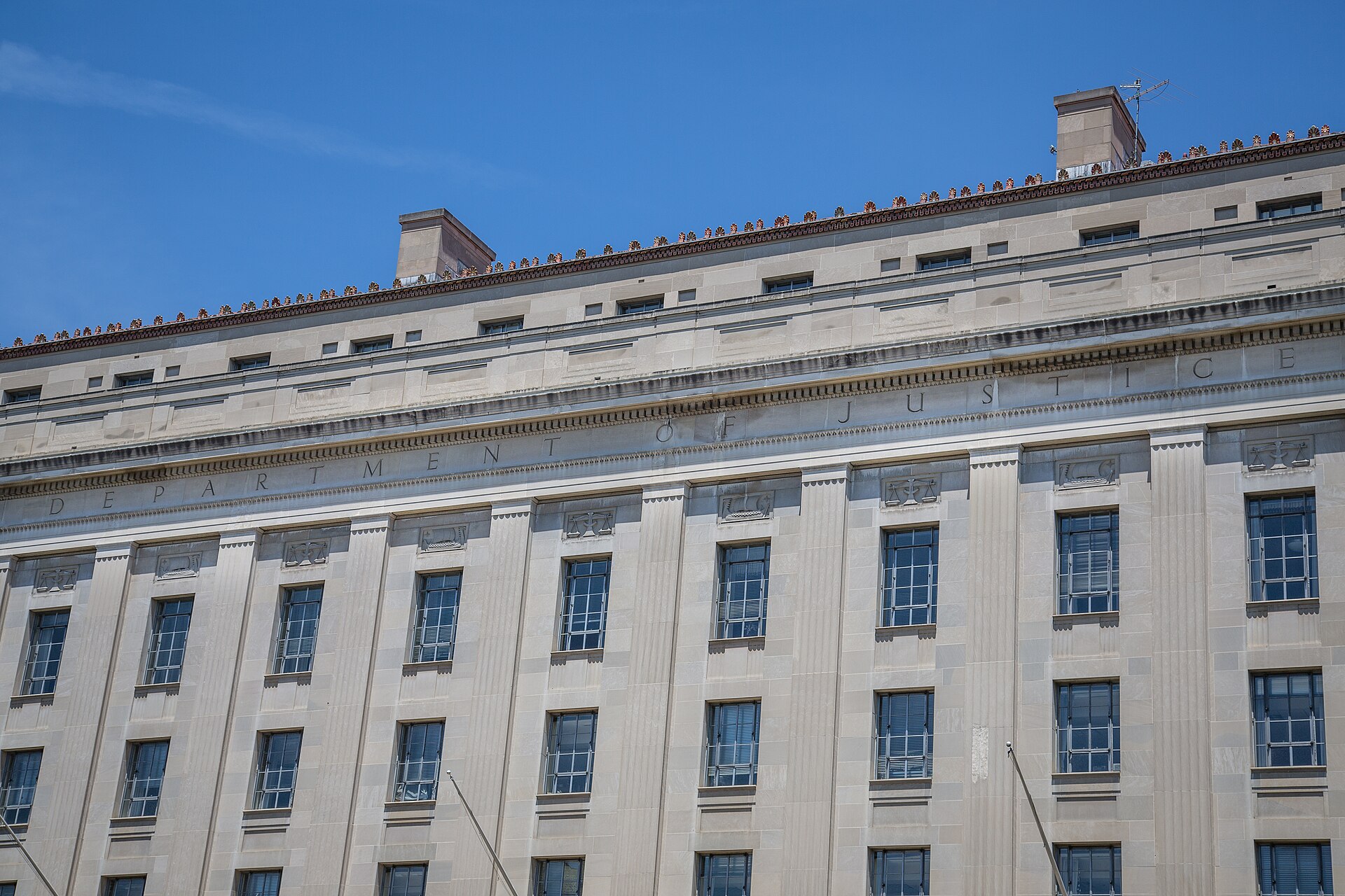 DOJ SNAP enforcement surge — the carved facade of the U.S. Department of Justice headquarters in Washington, which coordinated the nationwide cases