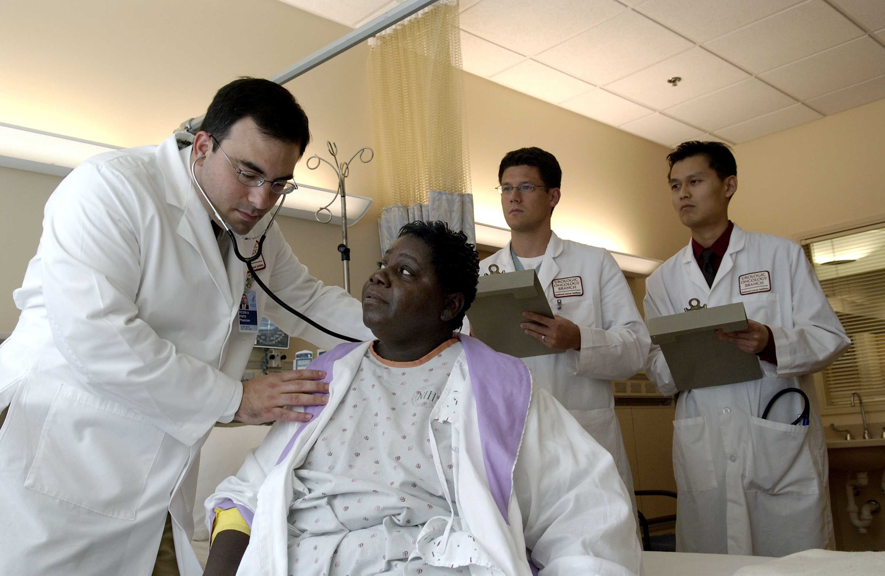 Doctor examining a patient — contacts under plague observation receive daily medical checks during the monitoring period