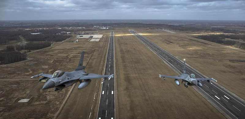 Two Dutch F-16 fighters above Šiauliai Air Base during a NATO Baltic Air Policing mission
