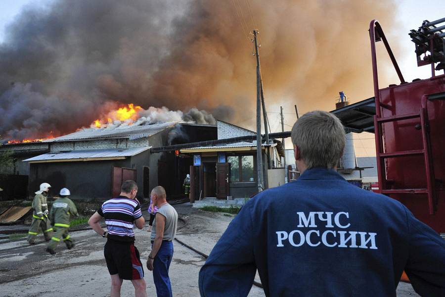 Firefighters and smoke at an industrial fire in a file photograph, not the October 2026 Krasnozavodsk explosion